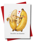 Greeting card with bananas hugging and text 'You drive me bananas' on a white background with red envelope.