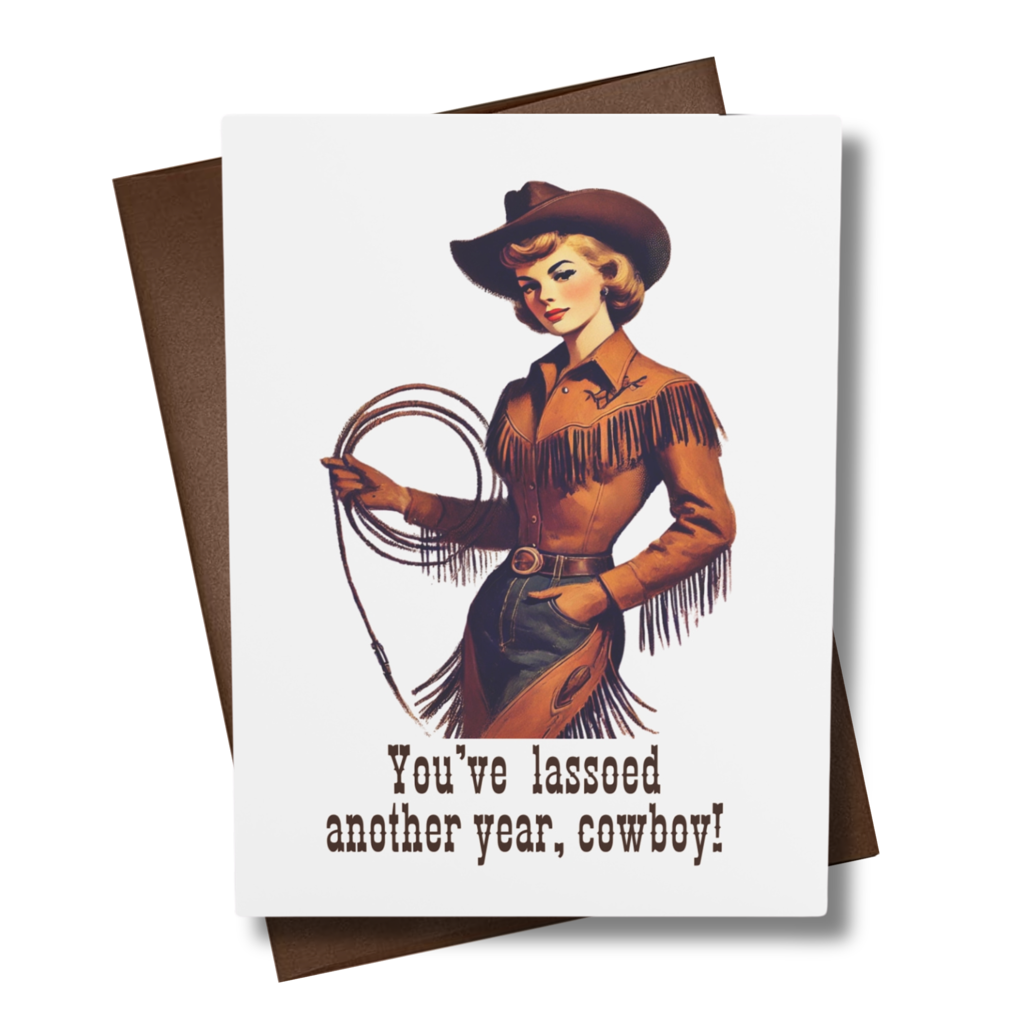 A retro style greeting card with a Western theme, featuring an illustration of a woman in a cowboy hat with a lasso. The text on the card reads 'You've lassoed another year, cowboy!'.